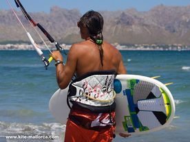 Daniel with his surfboard ready to go kitesurfing Daniel catching his surfboard to go on the water