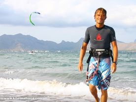 Gerhard happy after a session Gerhard in front of a kite and a kitesurfer
