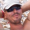Thumb Picture: Instructor Carlos relaxing on the beach during a break